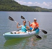 Two guests out on the lake in our complimentary, tandem sit-on-top kayaks.